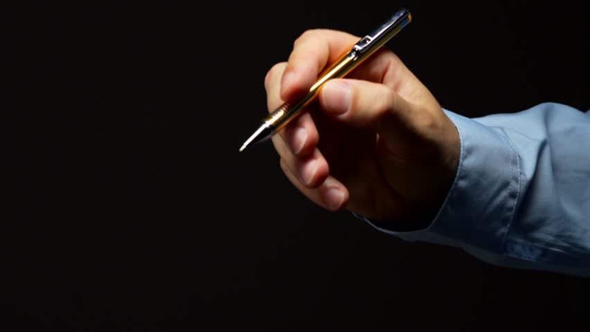 Pen for writing on black isolated background in hands of businessman.
Written work and writing text with pen.
Copywriter or writer with ink pen in hands