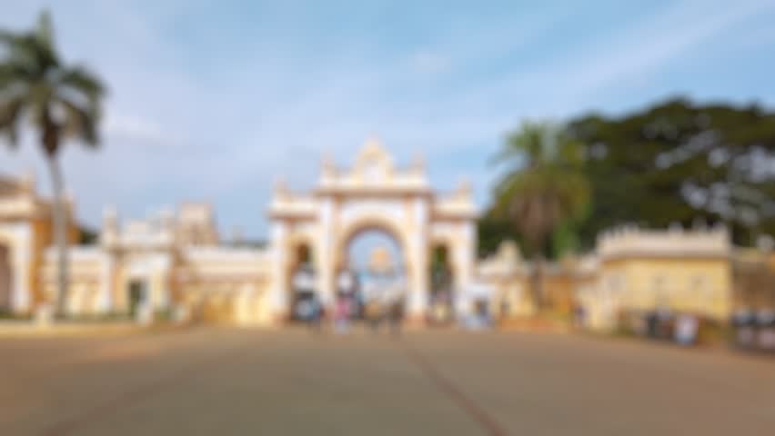 Bokeh view of tourists visit Mysore palace in Mysore, India. Blurred background footage.