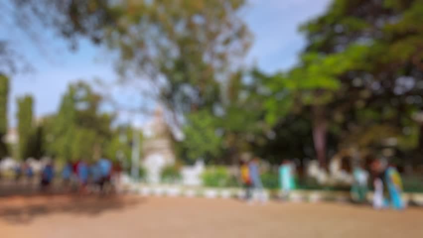 Bokeh view of tourists visit Mysore palace in Mysore, India. Blurred background footage.