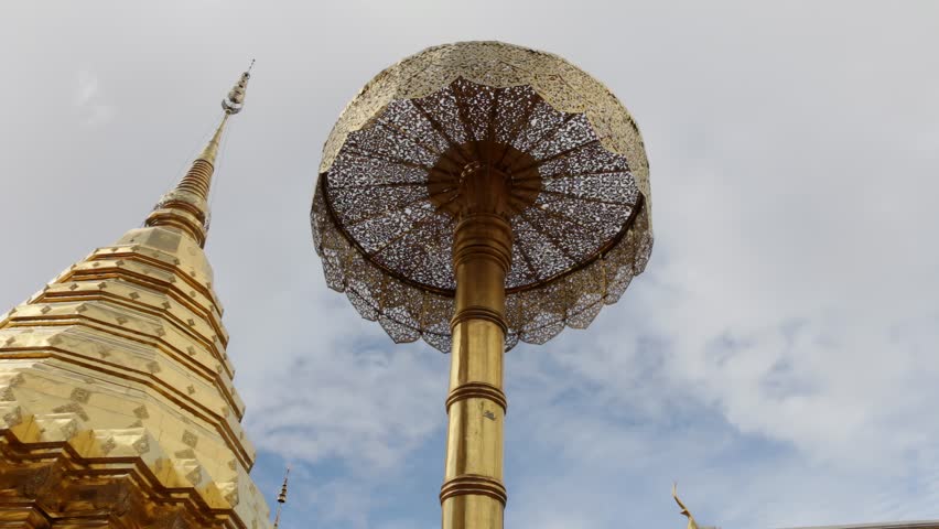 Low angle shot of the main golden chedi (pagoda) at Wat Phra That Doi Suthep, one of Thailand