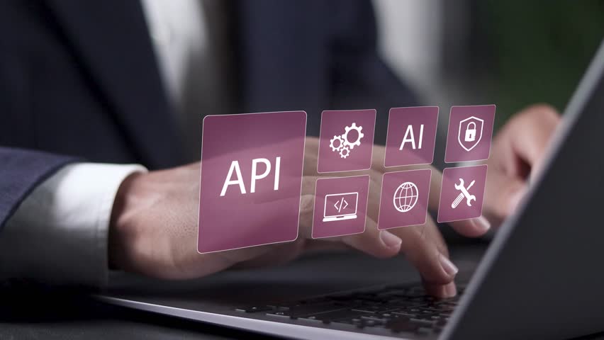 API, Application programing interface concept, software development tool, AI, Artificial Intelligence, information technology. Businessman using laptop with API icon on virtual screen. - Powered by Shutterstock - Get 15% off with code: PIKWIZARD15