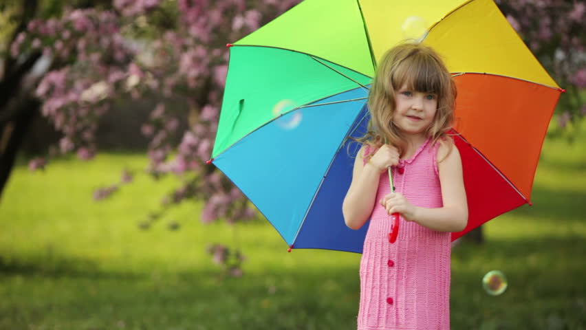 Funny girl playing with umbrella
