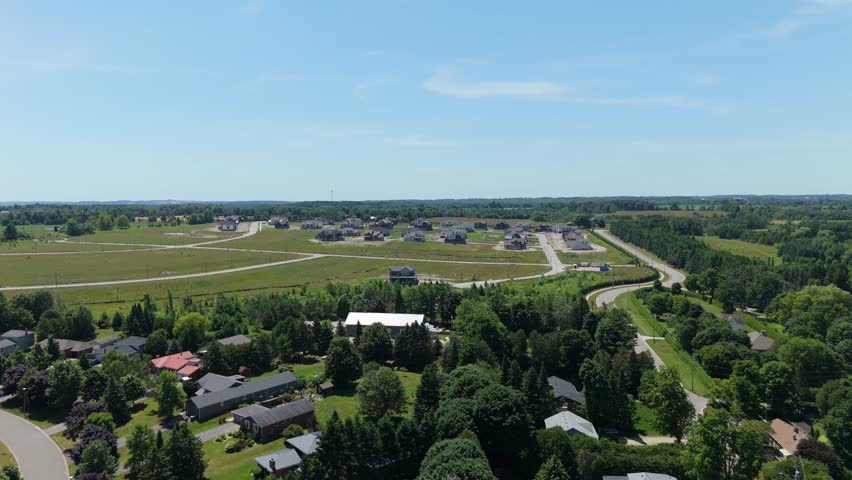 Aerial: new housing development during the day in Caledon, Ontario, Canada, establishing drone shot