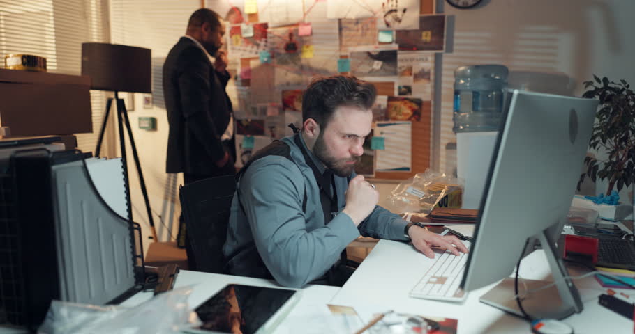 Computer, thinking and detective in office with typing for research on case with problem solving. Technology, ideas and professional male private investigator with surveillance for investigation.