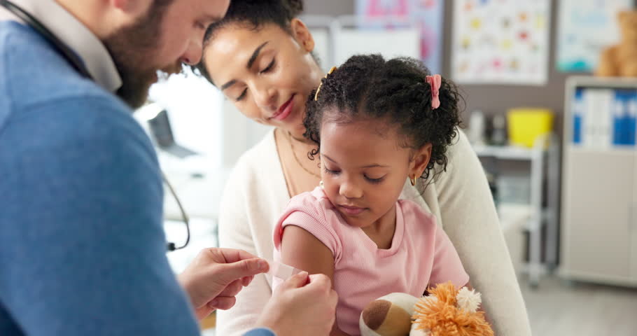 Doctor, mother and plaster on child at hospital for first aid, injection and virus vaccination. Pediatrician, helping and kid with bandage for medical checkup, immunization shot and wound protection