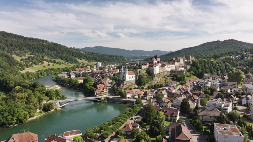 Aarburg castle and Aare river in Switzerland, drone view with summer green hills, medieval town and scenic alpine views.