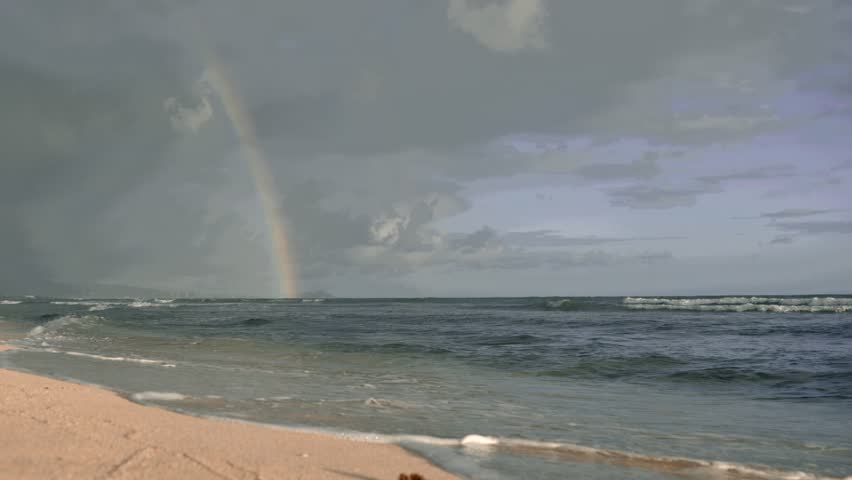 Rainbow at Hawaiian beach Honolulu Hawaii