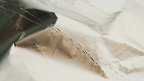 Crumpled foil close-up footage. Silver background and silver texture.  - Powered by Shutterstock - Get 15% off with code: PIKWIZARD15