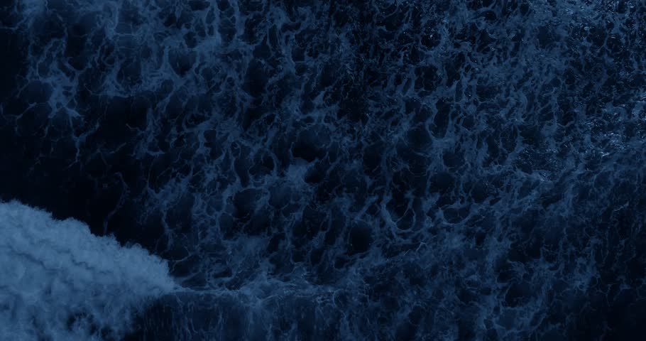 Top view of ocean waves at night. Power of ocean concept