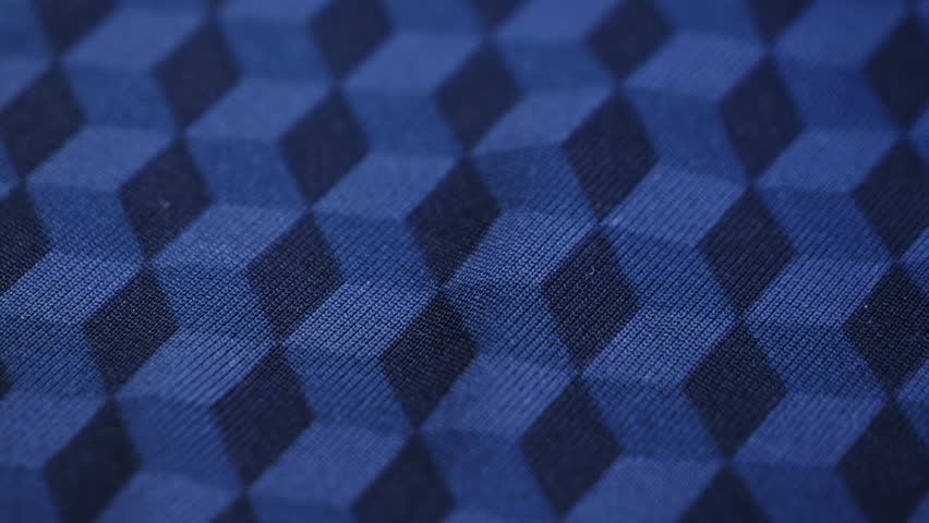 Blue textile with geometric pattern close up footage, texture and background concept. 