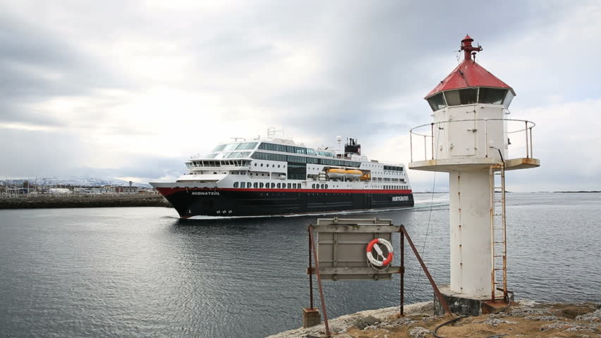 BODOE, NORWAY - MAY 2013: Along the coast of Norway the Hurtigruten ship is