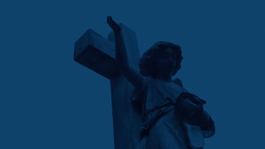 Gravestone Angel Figure In The Evening