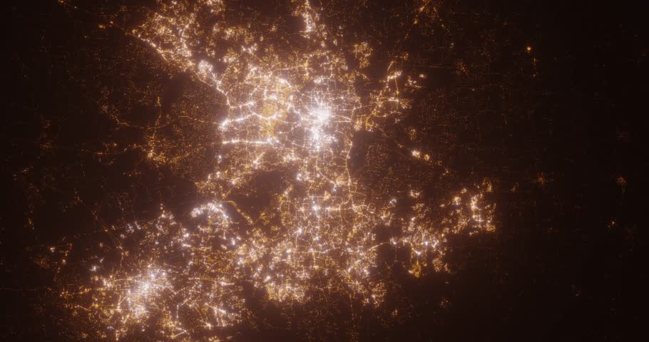 Raleigh (North Carolina, USA) top view at night. Aerial view on modern city from space. Camera is flying above the city, moving forward. Vertical video. The north is on the left side