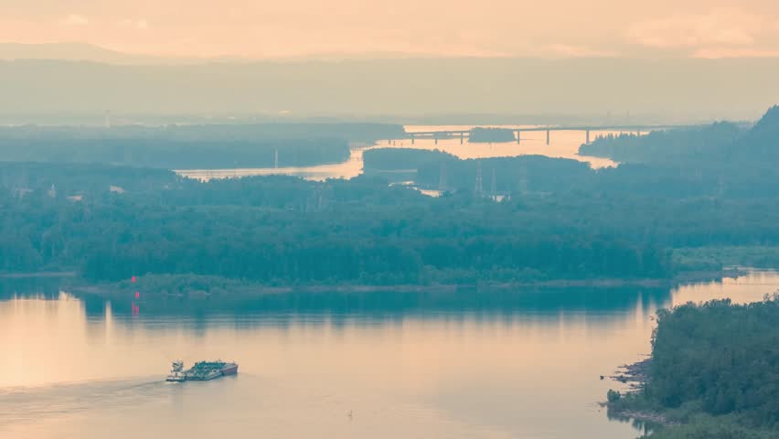 Aerial footage of the Columbia River shows a tugboat traveling through the river near Crown Point in the scenic Columbia Gorge.