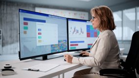 Financial Data Chart On Computer Monitor In Woman's Office. - Powered by Shutterstock - Get 15% off with code: PIKWIZARD15