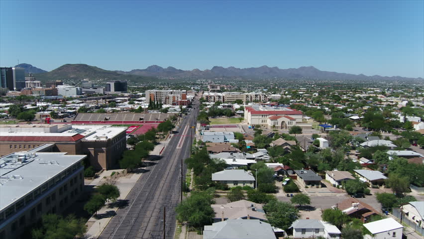 Drone footage along 6th Avenue in Tucson Arizona, ending at downtown