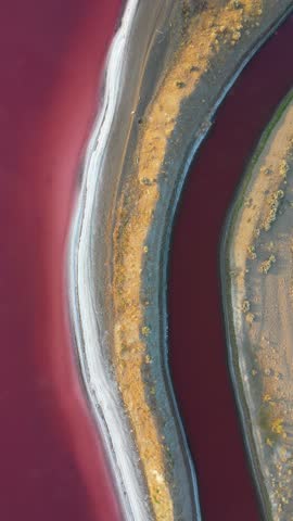 Vertical Drone Shot of Great Salt Lakes Evaporation Ponds, Pink Water and Colorful Patterns, Utah USA