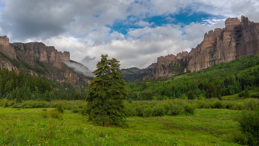 Timelapse of Mountain Landscape and Rock Formations With Clouds and Shadows. Mill Castle, Crested Butte, Colorado USA