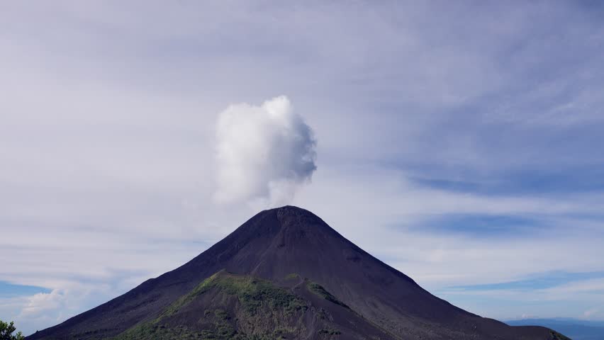 The Soputan volcano spewed volcanic gas and vapor from the vent, convulsion of nature; eructation