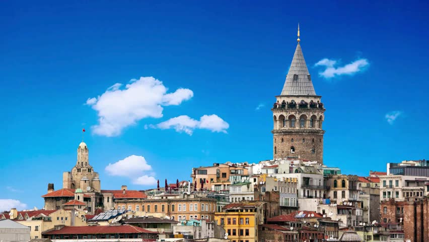 Galata Tower at Top of Beyoglu Hill Istanbul Turkey Sunny Autumn Day Aerial evening shot of the Galata Tower in Istanbul, Turkey. Aerial view of landmark at golden hour with beautiful sunlight.