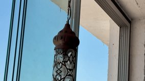 Elegant hanging lanterns casting intricate shadows in a bright, airy space. - Powered by Shutterstock - Get 15% off with code: PIKWIZARD15