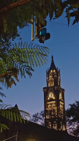 Rajabai Clock Tower In Evening Illumination. Clock Tower In Mumbai India. Confines Of Fort Campus Of University Of Mumbai. Modeled It On Big Ben In London. It Stands At Height Of 85 M or 280 Ft.