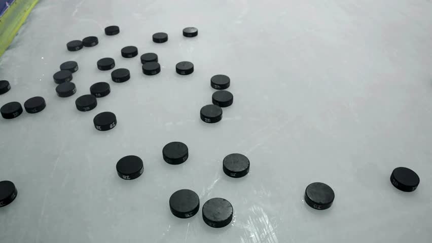 Blurred 4K footage of a professional hockey player practicing on the ice. The artistic motion blur captures the speed, energy, and intensity of athletic training, creating a dynamic and abstract shot