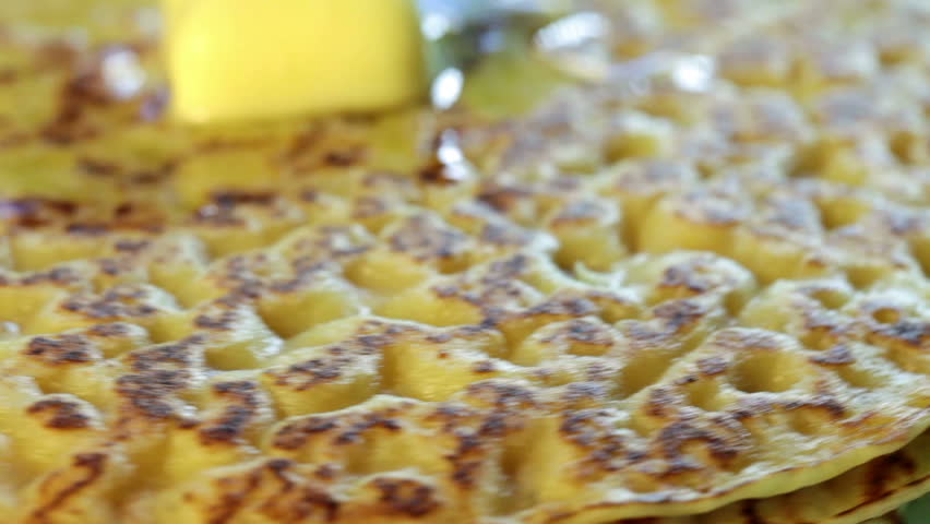 Appetizing fried pancake rotates close-up