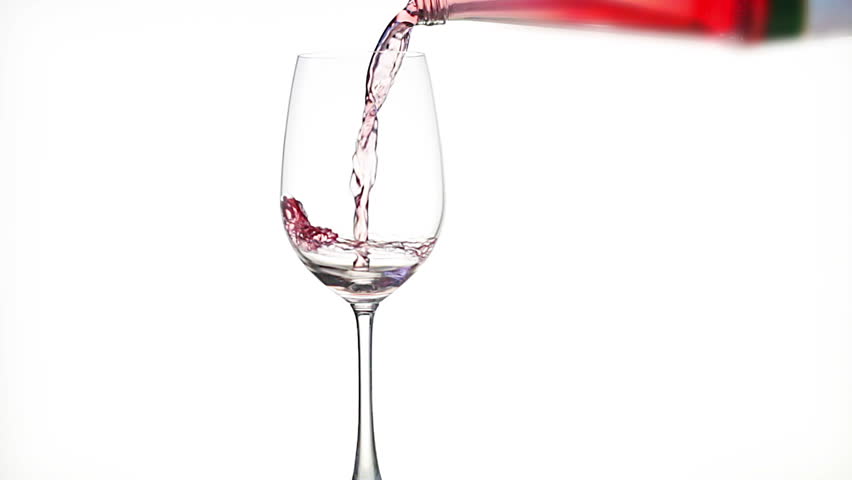 Red wine poured into stem glass