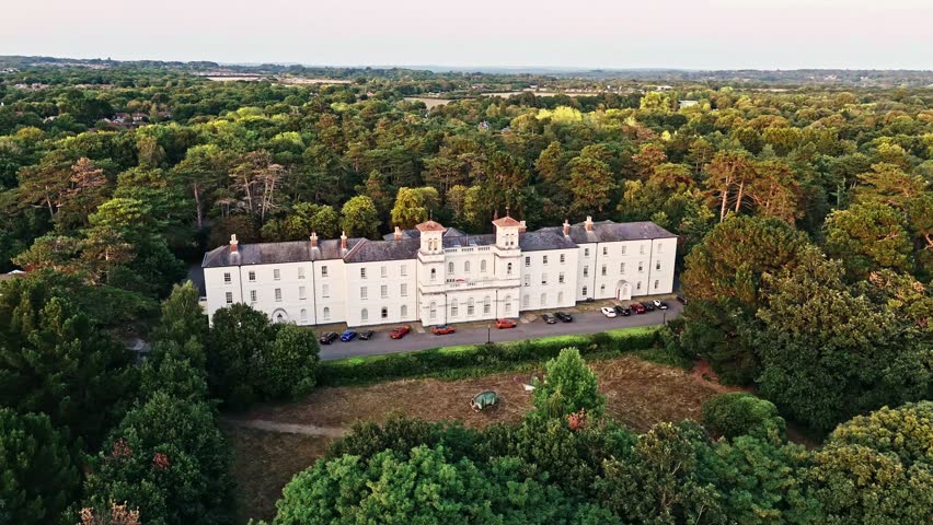 Aerial Panning Left Fast Drone View Of Large English British White Mansion In Nature With Trees At Sunset In Summer