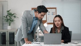 Business partners discussing over laptop in modern office, analyzing financial charts and graphs, developing new business strategies, working together on a project - Powered by Shutterstock - Get 15% off with code: PIKWIZARD15