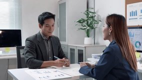 Business colleagues analyzing financial data, exchanging ideas, and celebrating successful collaboration with a handshake in a well equipped office - Powered by Shutterstock - Get 15% off with code: PIKWIZARD15