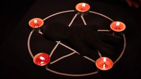 Woman dripping wax on voodoo doll.  - Powered by Shutterstock - Get 15% off with code: PIKWIZARD15