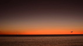 Soft morning glow rises over the Coral Sea as the last stars fade into the brightening sky, casting a tranquil light across the calm waters in a peaceful tropical dawn. - Powered by Shutterstock - Get 15% off with code: PIKWIZARD15