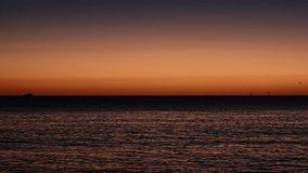 Soft morning glow rises over the Coral Sea as the last stars fade into the brightening sky, casting a tranquil light across the calm waters in a peaceful tropical dawn. - Powered by Shutterstock - Get 15% off with code: PIKWIZARD15