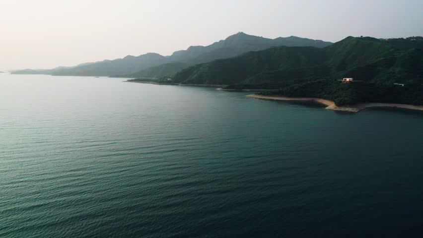 Beautiful drone view Tarbela lake in Khyber Pakhtunkhawa, Pakistan. Beautiful mountains, lush green meadows, beautiful valley, freash water, northern area of Pakistan, rural life, spa, nature.