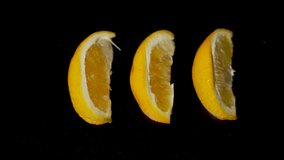 Juicy orange slices are squeezed, releasing fresh juice that splashes and flows in slow motion. The vibrant action contrasts beautifully against the black background. - Powered by Shutterstock - Get 15% off with code: PIKWIZARD15