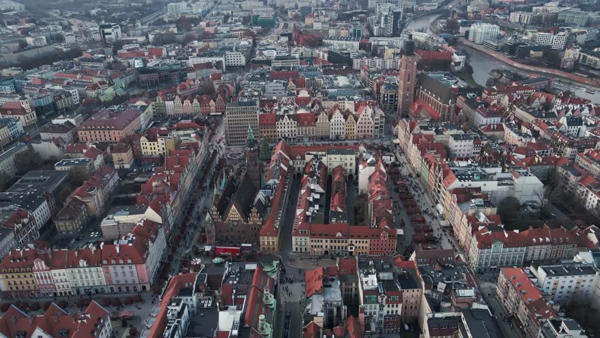 Aerial view of Wroclaw Market Square in Poland. European city with historic colorful buildings, the Old Town Hall and Christmas market stalls in winter