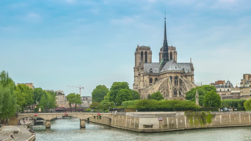 Paris France time lapse day to night city skyline at Notre Dame de Paris Cathedral and Seine River