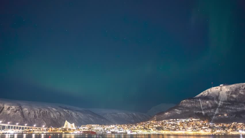 Tromso Norway time lapse of the aurora borealis northern lights at city sentrum skyline harbor