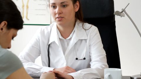 Female doctor comunicate bad news - tracking shot