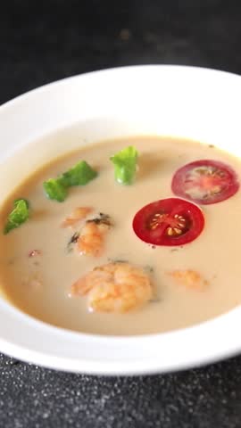 Tom kha soup shrimp, coconut milk, miso paste tasty seafood snack fresh delicious gourmet food background on the table rustic food top view copy space pescetarian diet