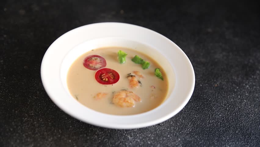 Tom kha soup shrimp, coconut milk, miso paste tasty seafood snack fresh delicious gourmet food background on the table rustic food top view copy space pescetarian diet