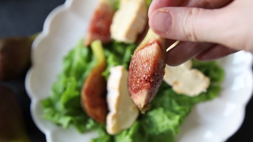 Figs salad, soft cheese, green leaf lettuce tasty snack fresh delicious gourmet food background on the table rustic food top view copy space keto and paleo diet vegetarian food