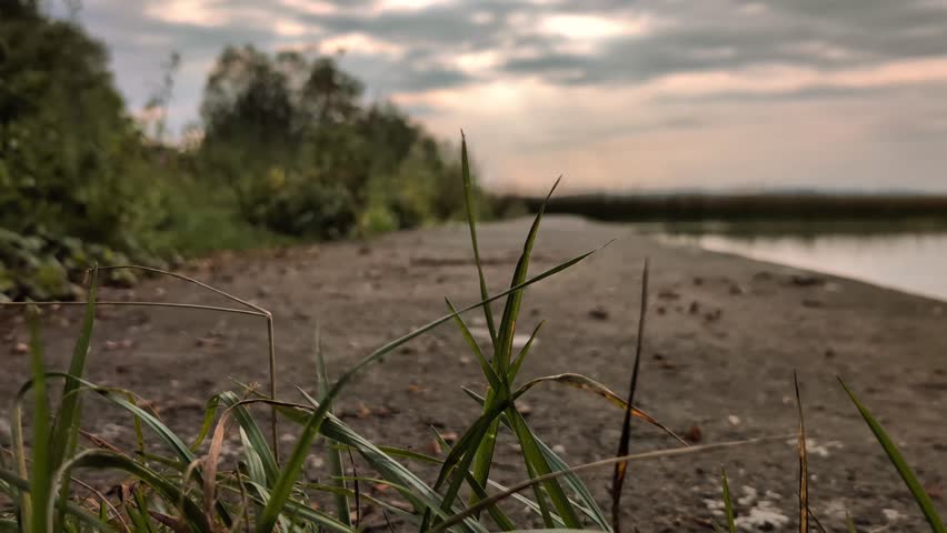 Man Riding Mountain Bike on Countryside pier Near Lake Under Cloudy Sky, sport and activities, lifestyle, freedom