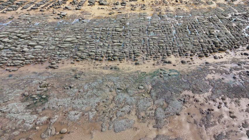 View from the sky over the rock pools towards the stripey cliff face at Hunstanton on the Norfolk coast.