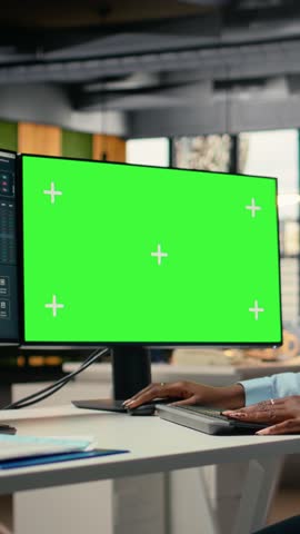 Vertical video Portfolio manager analyzes market trends on green screen PC to enhance investment returns. Financial expert tracks performance metrics on mockup computer to identify investment