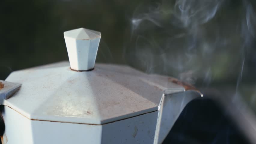 Italian metallic coffee geyser maker. Mocha coffee pot for making espresso coffee