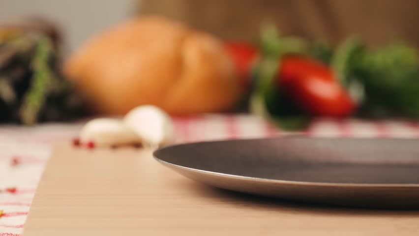 Ham italian mordatella, man Slices Of Traditional Italian antipasti mortadella sausage on a wooden cutting board, close up macro of chicken or turkey jamon, fat breakfast dish.