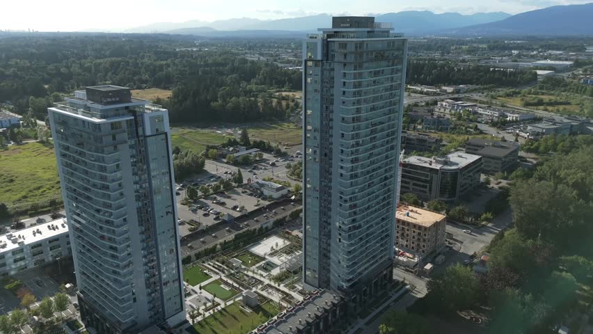 Condominium Towers Near The Highways In Daytime In Langley, BC, Canada. - aerial shot
